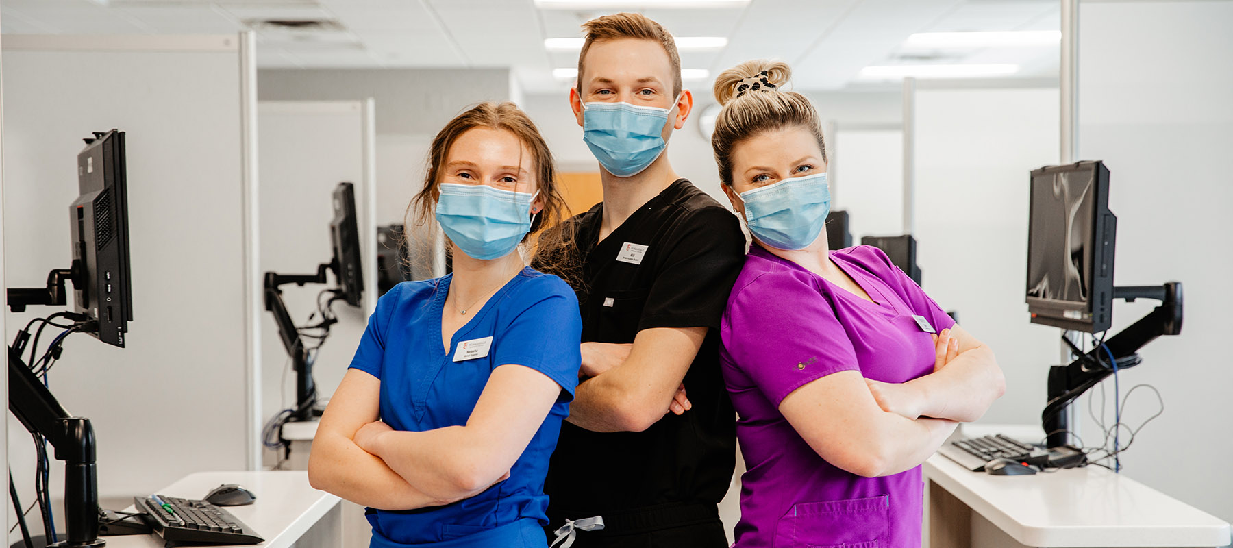 Three Normandale students in the dental hygiene clinic