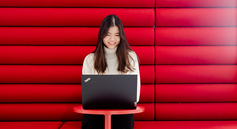 Female Normandale student looking up the options for community college courses