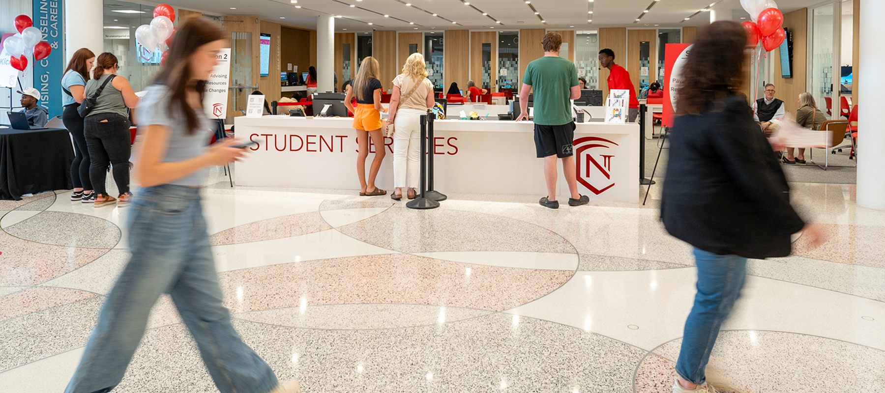  A Student Services coach and student discussing class schedules.