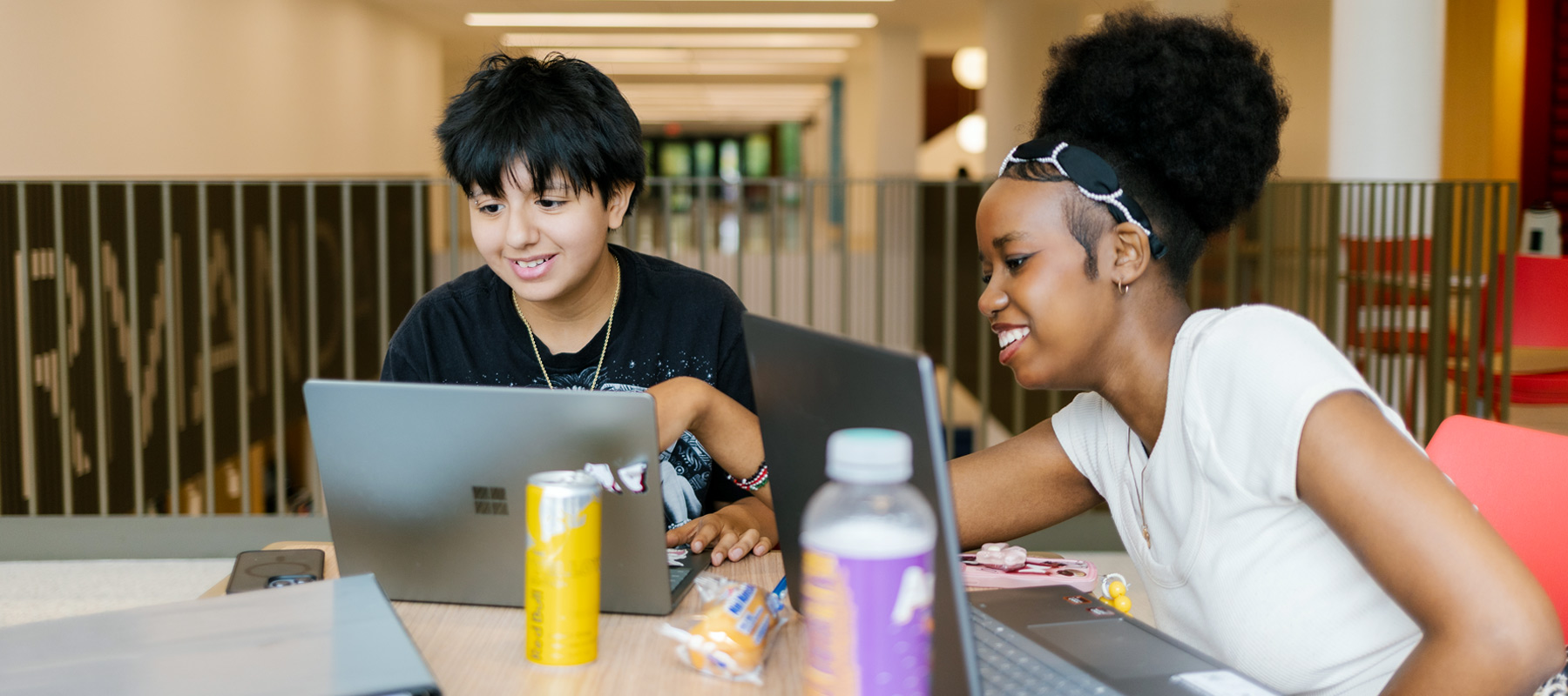 A Normandale student helping another Normandale student learn about financing options