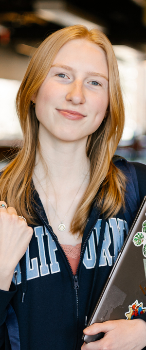 A Normandale student smiles at the camera